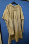 19th Century Farmers Smock, with long sleeves, mother of pearl buttons and detailing to the arms and