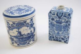 Delft jar and cover, 20th Century together with a Delft tea caddy with floral design and birds (2)