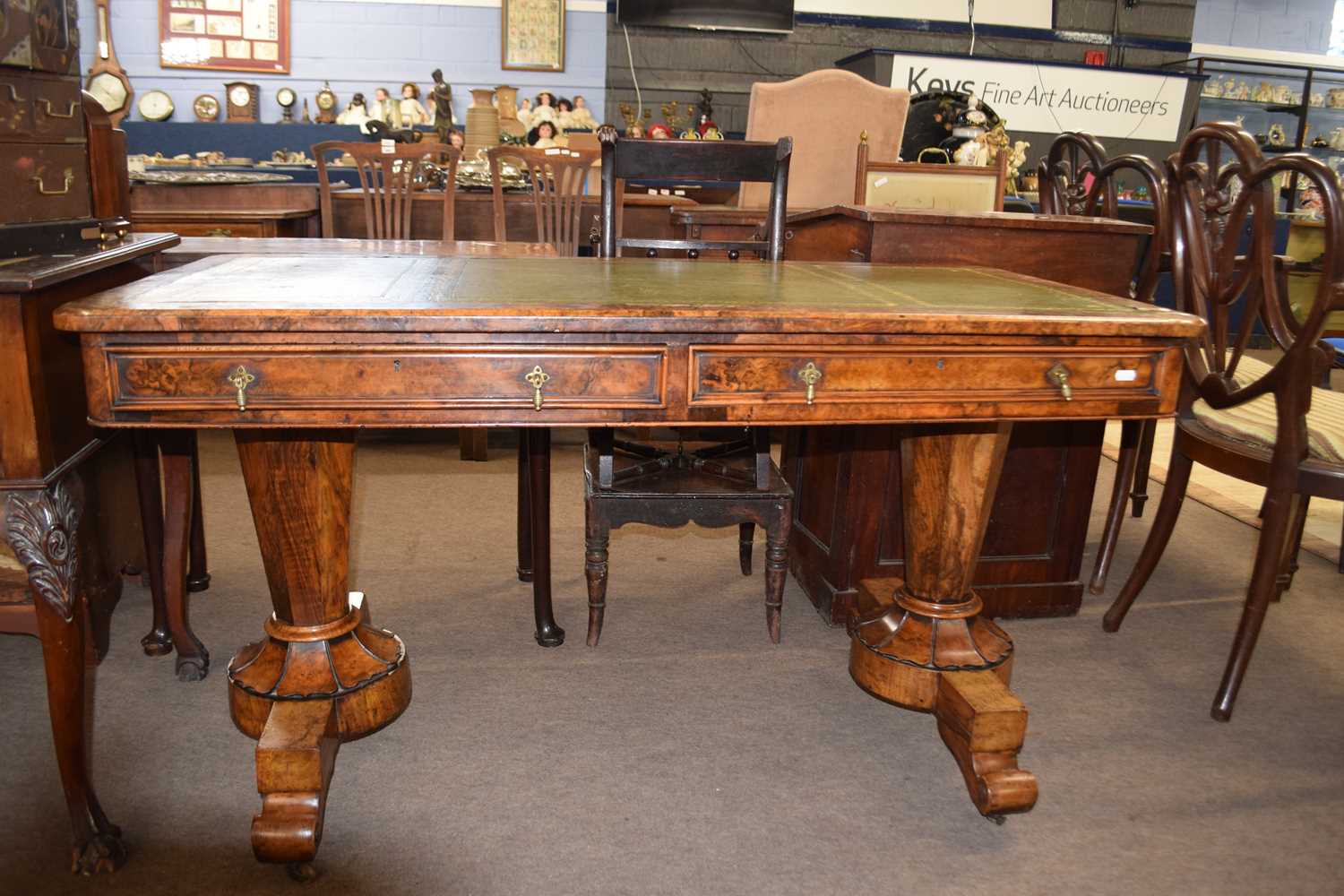 19th Century walnut veneered twin pedestal writing table with green tooled leather surface over