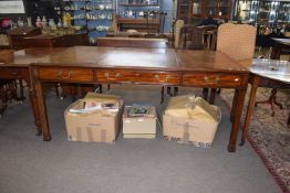 Arthur Brett & Sons, Norwich, a reproduction writing table of large proportions, the top with