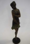 Art Deco Spelter model of a 1920's flapper girl on circular base, 56 cm high