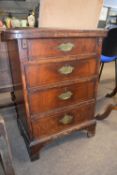 Small 18th Century and later walnut and inlaid bachelors chest with shaped flip top over four