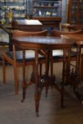 Late 19th Century mahogany octagonal centre table raised on turned legs with base shelf and casters,