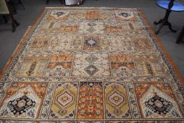 Large 20th Century wool floor rug decorated with stylised lozenges on a principally beige and rust