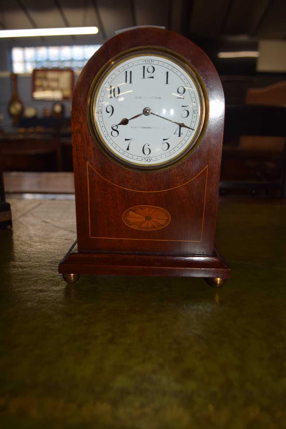 Small Edwardian mantel clock in mahogany case with inlaid detail, the face indistinctly signed