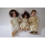Three smaller dolls including a Limoges doll and two German dolls in original clothing