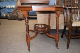 Late Victorian American walnut centre table with octagonal top raised on turned legs, 75cm wide