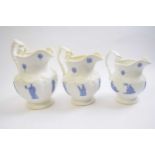 Graduated set of three 19th Century porcelain jugs the white ground with blue sprigged decoration of
