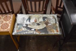 Coffee table, the top decorated with a feather picture of a duck