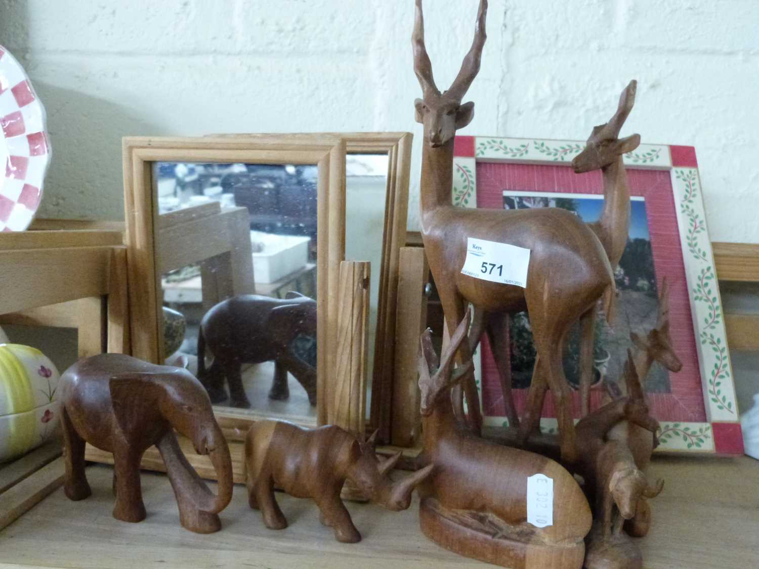 Collection of various wooden antelope and other animals, two small dressing table mirrors and a