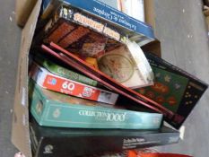 One box of various jigsaw puzzles