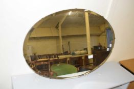 Oval bevelled wall mirror