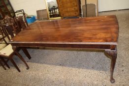 Edwardian mahogany dining table of narrow rectangular form raised on tapering legs with pad feet,
