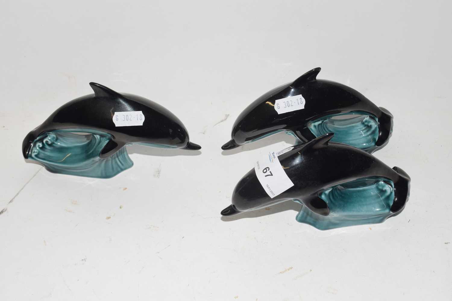 Three Poole Pottery dolphins