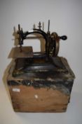 Vintage cast iron sewing machine and accompanying case