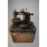 Vintage cast iron sewing machine and accompanying case