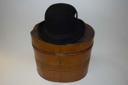 Vintage bowler hat and a metal hat box