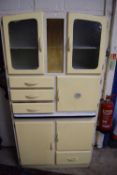 Retro kitchen cabinet with glazed top section, pull out enamel covered work surface and various