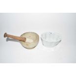 Pestle and mortar and a ceramic jelly mould