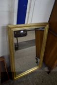 Modern rectangular bevelled wall mirror in gilt finish frame, 108cm high