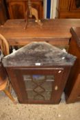 Georgian oak corner cabinet with shelved interior and glazed door