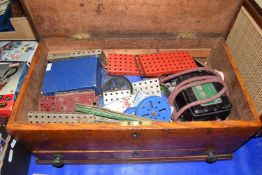 Wooden box of various Meccano parts