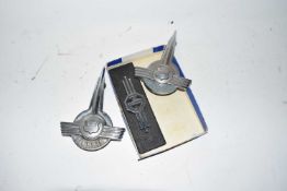 Three vintage car badges, two marked Morris, one marked MG