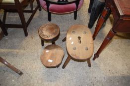 Mixed Lot: Small circular top milking stool with carved decoration, a further four footed stool