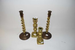 Two pairs of brass candlesticks