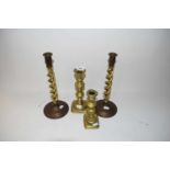 Two pairs of brass candlesticks