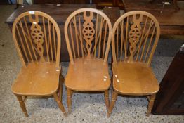 Three stick back kitchen chairs