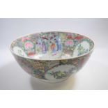 Large Japanese porcelain punch bowl, 20th Century with polychrome designs of flowers and Chinese