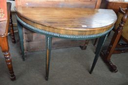 Mahogany demi lune hall table with applied carved detail and painted legs, 115cm wide