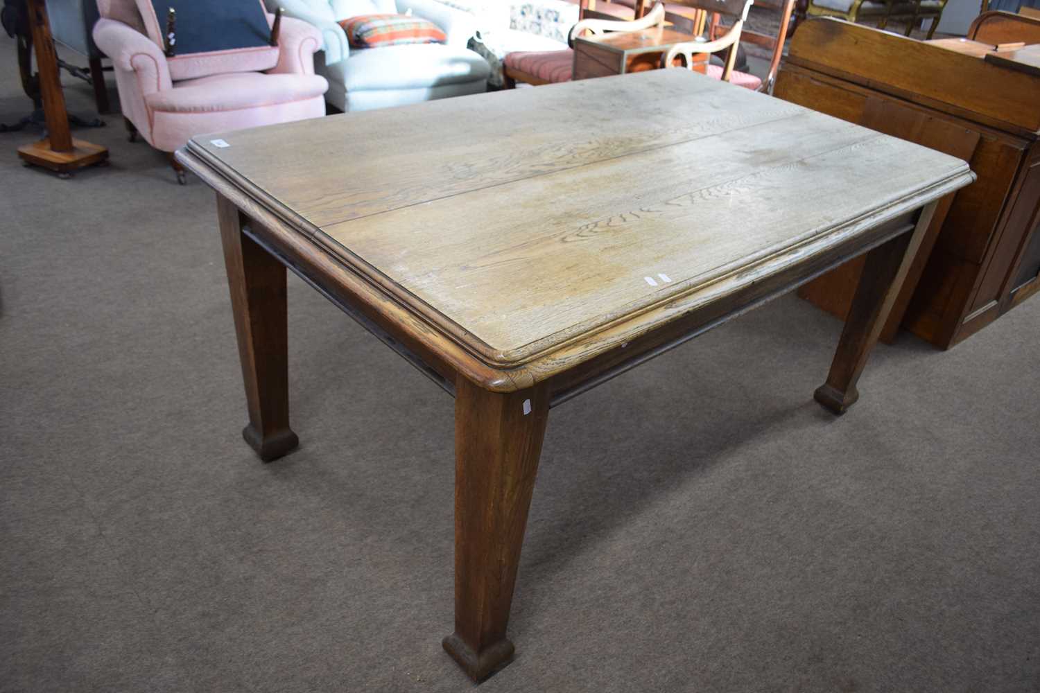 Early 20th Century rectangular oak dining table raised on tapering square legs, 152cm wide