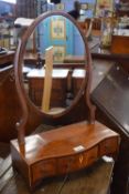 Small mahogany veneered dressing table mirror with oval mirror over a serpentine base with three