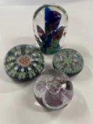 Victorian dump paperweight together with three further paperweights