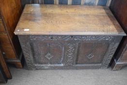 18th Century oak coffer with two panelled front surrounded by carved decoration, 97cm wide