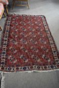 20th Century Middle Eastern wool floor rug decorated with a central panel of octagonal lozenges on a