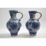 Two German Rhenish stone ware type ewers with applied blue decoration, 26cm high