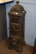 Tall continental cast iron stove decorated with figures, 110cm high