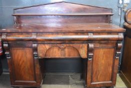 19th Century mahogany twin pedestal side board with four drawers and two panelled doors raised on