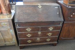 Large 18th Century oak bureau with full front opening to a interior with small drawers and pigeon