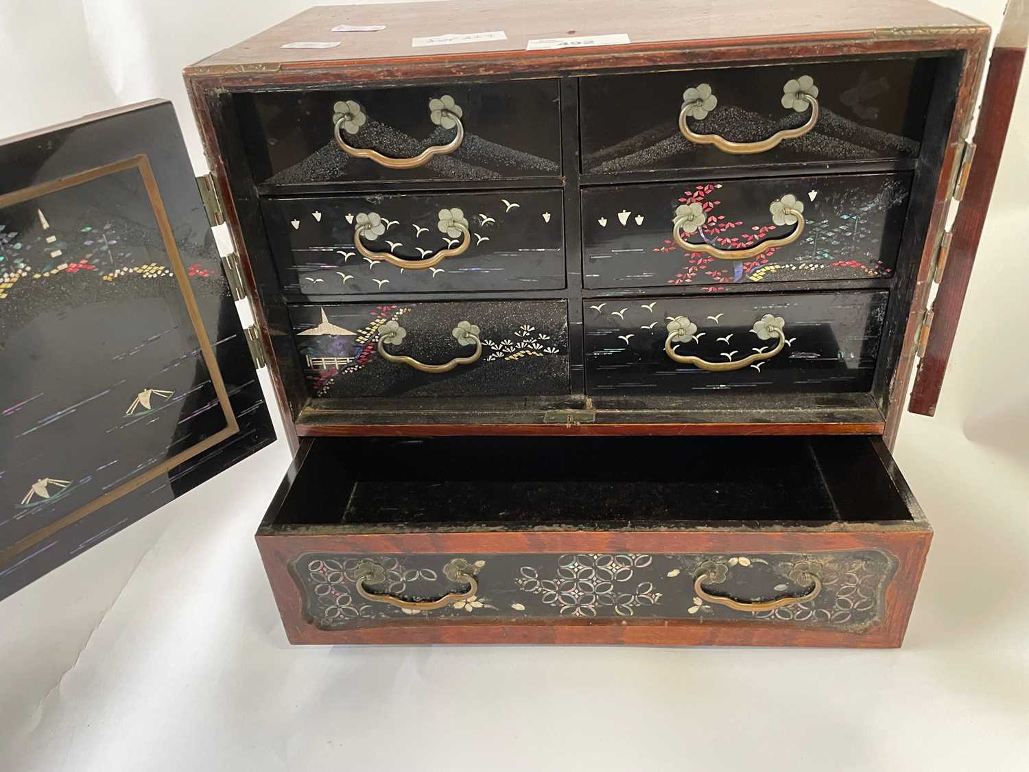 Early 20th Century Oriental table top box with two panelled doors opening to an interior with six - Image 4 of 4