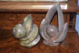 Two 20th Century African abstract soap stone sculptures, the larger figure signed Shame Chakkwana