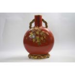Large Royal Worcester moon flask, early 20th Century, the orange ground with gilt floral