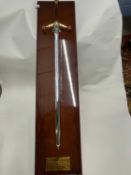 Large Wilkinson commemorative sword mounted on a polished hardwood back bearing presentation