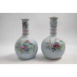 Pair of Copeland stone ware vases, the pale blue ground with floral famille rose decoration, 27cm