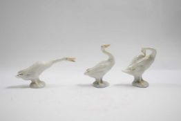 Group of three Lladro geese in various poses