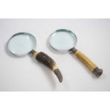 Two magnifying glasses with horn handles and silver collars, assay marks for Birmingham