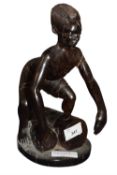 Carved African wooden figure of a drummer, 28cm high